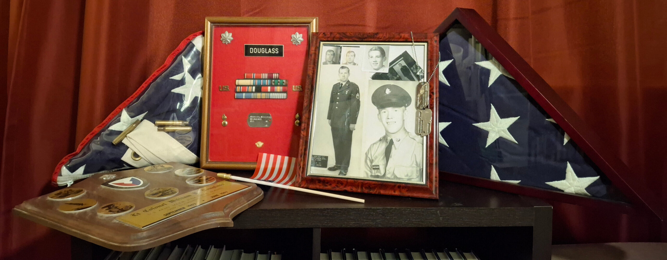Military paraphernalia including photos and American flags