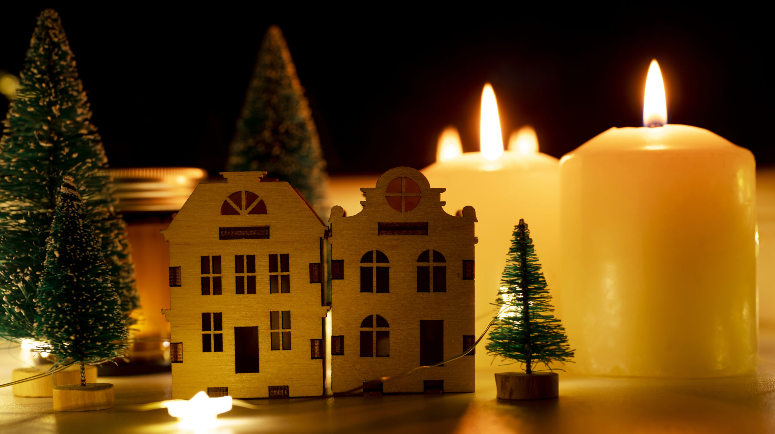 Christmas ornaments with candles on a table